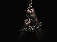 hands bound and hanging on a rope